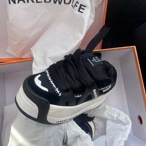Naked Wolfe Black and White Sneakers.